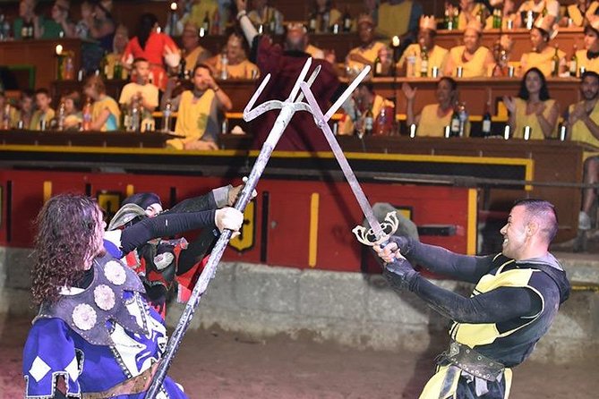 Medieval Show and Dinner at Castillo San Miguel with Transfer - Eating a medieval-style banquet during the show