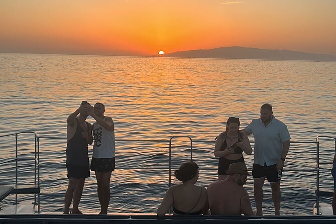 Tenerife Sunset Catamaran tour with transfer - Food and Drinks included. - Pack for a wet, breezy afternoon